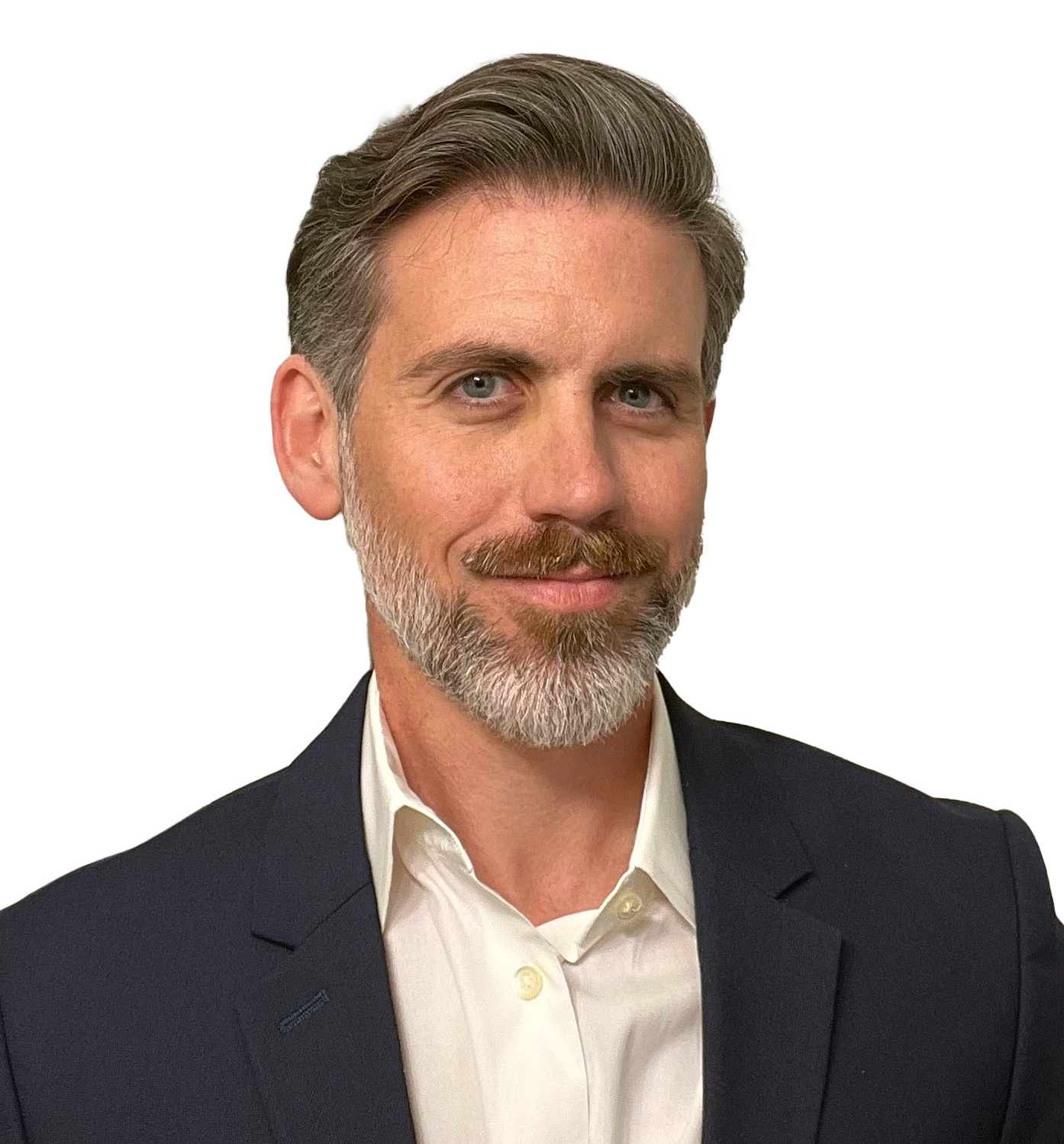 Headshot of Tyler Hicks. 40 year old white male with patchy grey beard wearing a blue suit and white shirt